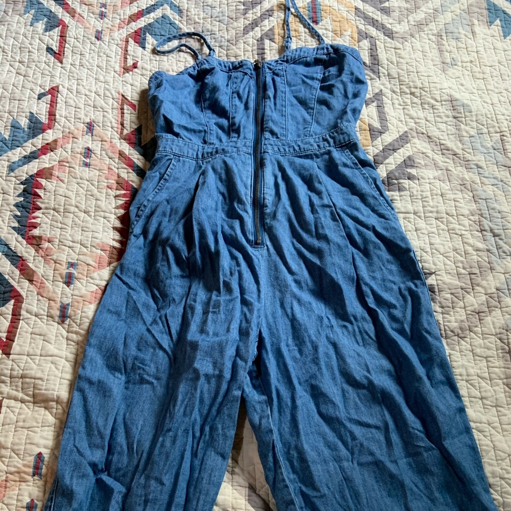 Denim sleeveless jumpsuit with sweetheart neckline and pockets